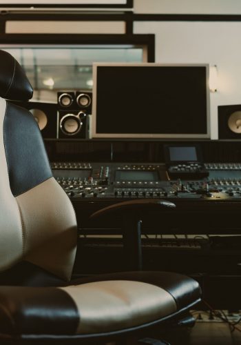 armchair in front of graphic equalizer at recording studio